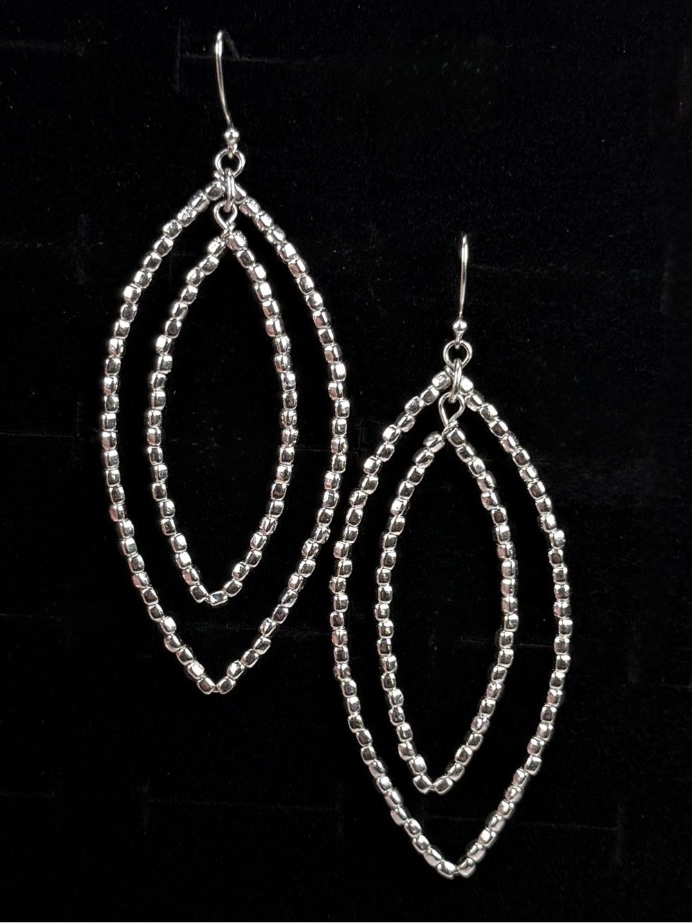 Interesting lightweight Silvertone long pierced earrings